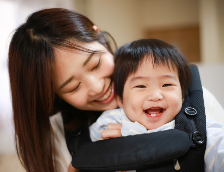 mother and baby smiling