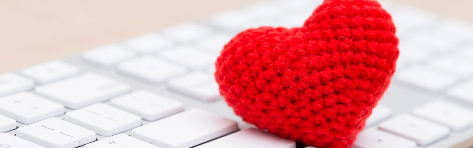 crochet heart on a keyboard